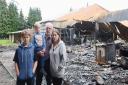 The family home of Alex and Faye Morse in Shipdham was destroyed by fire. Also pictured are their children Bono (14) and Brian (4). Picture: Ian Burt