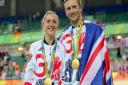 Great Britain's Jason Kenny after winning the gold medal in the Men's Keirin Final poses with fiancee Great Britain's Laura Trott who won gold in the Women's Omnium Points Race. Picture David Davies/PA Wire