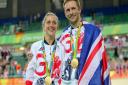 Great Britain's Jason Kenny after winning the gold medal in the Men's Keirin Final poses with fiancee Great Britain's Laura Trott who won gold in the Women's Omnium Points Race. Picture David Davies/PA Wire.