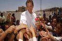 File photo dated 29/05/03 of former Prime Minister Tony Blair with school children in Basra, Iraq. Photo: Stefan Rousseau/PA Wire