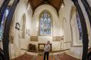 St Mary's Church in Sedgeford has just undergone a £365,000 revamp - Church warden Pam Goddard in the repaired altar area. Picture: Matthew Usher.