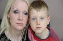 Alfie Holland-Pengelly, 8, who was bitten by a dog whilst playing on Fearns Field in Cromer on Sunday 24th April, and is now scared to go back there. He's pictured with his mum Jayne Holland. Picture: MARK BULLIMORE