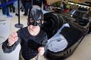 A Batmobile car draws the crowds, including Toby Barber (4), at the Superheroes Fun Day at Castle Mall. PHOTO BY SIMON FINLAY