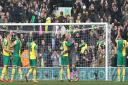 Handshakes and smiles all round as the the Norwich City players get a huge round of applause from the home fans at the end of their 0-0 draw with Manchester City. Picture: Paul Chesterton/Focus Images