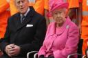 Queen Elizabeth II and the Duke of Edinburgh listen to a choir during the official opening of the refurbished Birmingham New Street Station. PRESS ASSOCIATION Photo. Picture date: Thursday November 19, 2015. See PA story ROYAL Railway. Photo credit should