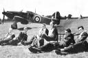 Battle of Britain pilots next to an airplane