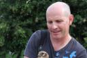 Mike Dilger with Mo the Montagu's harrier when it was tagged in the Netherlands. The bird disappeared in the Great Bircham area on August 8 2014.