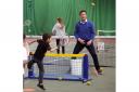 Liberal Democrat leader Nick Clegg (right) playing mini-tennis at a leisure centre in Solihull with local children. PRESS ASSOCIATION Photo. Picture date: Tuesday May 5, 2015. See PA story ELECTION LibDems. Photo credit should read: Steve Parsons/PA Wire