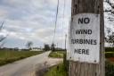 A sign on a telegraph pole on Rhoon Road near Terrington St Clement, near one of the proposed wind turbine sites. Picture: Matthew Usher.