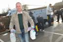 Water supplies are made available by bottle and emergency water boxes at Poringland Community Centre after the water main burst. Clive Gordon gets supplies.Picture by SIMON FINLAY.