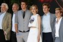 The cast (from left) actor Donald Sutherland, director Francis Lawrence, actors Liam Hemsworth, Jennifer Lawrence, Sam Clafin and Josh Hutcherson pose for photographers during a photo call for Hunger Games: Mockingjay Part 1 at the 67th international film