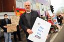 Mark Harrison, CEO Equal Lives, with other protesters outside the Atos assessment centre at St Mary's House. Picture: Denise Bradley