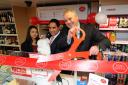 South Norfolk MP, Richard Bacon, officially opening the Ditchingham Post Office at its new location in the village shop.Owners Raj and Kuljit Thandi with their baby daughter Simran.Picture: James Bass