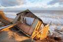 Hemsby wakes up to the early morning sun to the scene of devastation when the high tides destroyed homes on the dunes. PHOTO BY SIMON FINLAY