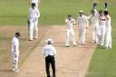 Australia captain Michael Clarke reacts to umpire Aleem Dar with teammates Ed Cowan, Brad Haddin and bowler Ashton Agar after catching out England's Stuart Broad for him to be then ruled not out, during day three of the First Investec Ashes Test match at 