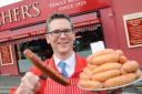 Jamie Archer with his gold award winning Chilli sausages. Picture: Denise Bradley