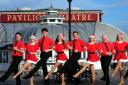 Olly Day and the cast launching the Cromer Christmas Special on the pier.  Photo: Bill Smith