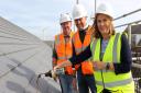 Dawn Edwards of Orwell Housing \'tops out\' 31 new affordable homes at Alexandra Road in Lowestoft, watched by Paul Pitcher (centre) and Bob Dowler (left) of constructor Wellington.