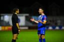 Aaron Jones has a friendly word with official Lauren Impey during the game against Alfreton - but it was the abuse Lynn fans gave the official that has proved costly