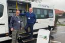 Mark Mabbitt (right), from Hearing From Norfolk, with a volunteer by the Cuppa Care bus