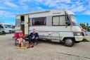 Helen Gosling, Andrew White and Honey Bear with their motorhome