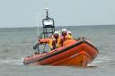 A fisherman who had his foot caught in a tow rope and dragged out to sea was found safe and well