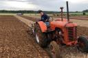 Norfolk Plouging Society chairman George Carman at the wheel of his vintage tractor