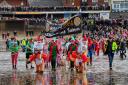 Thousands have turned out to take a chilly plunge into the North Sea this Christmas Day. Picture: Chris Bishop