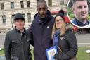 Idris Elba (centre) with Phil Dix, left, and Emma Dix, right, parents of Joe (inset) who was stabbed to death in Norwich