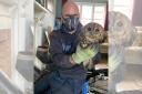 Chimney sweep Darrel Cucu with one of the rescued owls