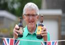 David Elvidge with the beers he still hasn't drunk from the Silver and Golden jubilees