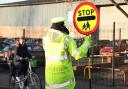 John Curtis, 83, a school crossing patrol man who has been a lollipop man for over 20 years. Outside Catton Grove Primary school. Pictures: Brittany Woodman