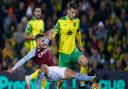 Jacob Sorensen challenges Emi Buendia during Norwich City's loss to Aston Villa