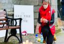 Jo Rust lights a candle in memory of Sarah Everard. Pictured: Ian Burt