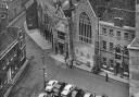The chequer work of stone and flint of the 15th century Trinity Guildhall at King's Lynn stands out in the picture taken from St. Margaret's Church tower, 1955. Photo: Archant Library