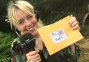 Radio Norfolk Treasure Quest presenter Sophie Little with a clue. Credit: BBC