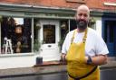Chef Charlie Hodson stands outside Hodson & Co. in Aylsham, hoping to be named the UK's smallest restaurant
