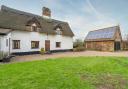 This thatched cottage is selling for £500k