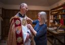 Revd Canon Dr Andrew Braddock being fitted for the Birkbeck Cope ahead of his installation as Dean of Norwich.