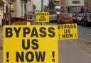 Protest signs calling for a new bypass at Long Stratton