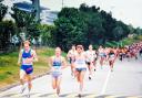 From left to right Neil Featherby leading the bunch after the start of the Hong Kong Marathon along with the USA’s Doug Kurtis (runner up) and eventual winner Rick Mannes from Canada.