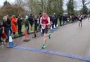 Mark Armstrong crosses the finish line at the Valentine's 10K