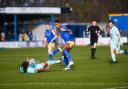 Gold Omotayo in the thick of the action against Torquay in March 2022 - now the Devon side are facing administration