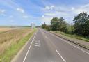 The A140 Cromer Road is closed after emergency services were called to a crash