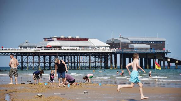 Eastern Daily Press: People enjoying the summer sunshine on Cromer beach. Picture: ANTONY KELLY Eastern Daily Press: People enjoying the summer sunshine on Cromer beach. Picture: ANTONY KELLY