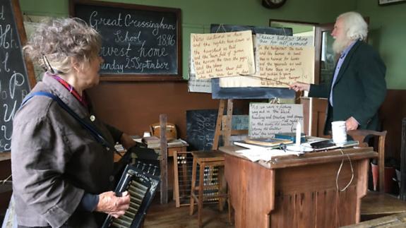 Eastern Daily Press: Open day at Great Cressingham Victorian School. Owners Sally and Tom North lead visitors in a hymn. Eastern Daily Press: Open day at Great Cressingham Victorian School. Owners Sally and Tom North lead visitors in a hymn.