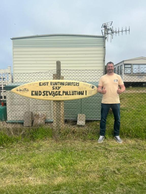 Eastern Daily Press: Darren Veal with the surfboard protest Eastern Daily Press: Darren Veal with the surfboard protest