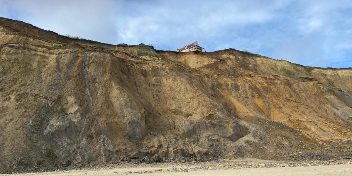 Homes dangling after cliff fall at Trimingham, north Norfolk 