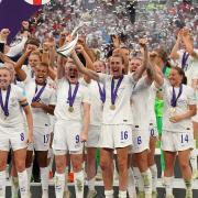 England's Ellen White and Jill Scott lift the trophy as England celebrate winning the UEFA Women's Euro 2022 final at Wembley Stadium