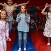 Youngsters have fun on a bouncy castle
